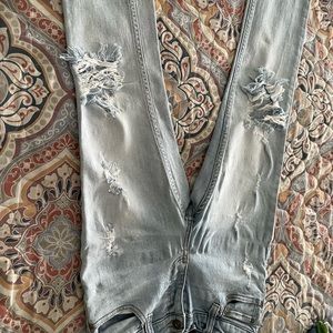 Barley used pair of boys ripped jeans.